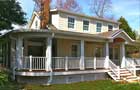 welcoming wrap-around porch, new siding and roofing