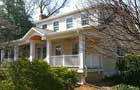 wrap around porch with portico and new siding